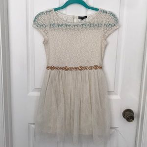 Cream lace dress by Michelle Girls.